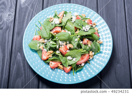 Strawberry salad with spinach , cheese and walnut Strawberry salad with spinach , cheese and walnut 49234231