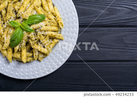 Italian penne pasta with sauce pesto Italian penne pasta with sauce pesto 49234233