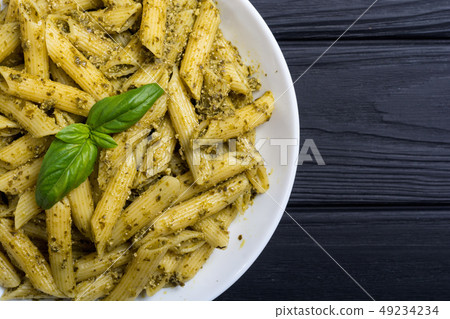 Italian penne pasta with sauce pesto Italian penne pasta with sauce pesto 49234234