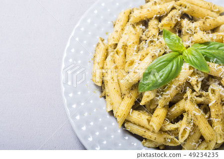 Italian penne pasta with sauce pesto Italian penne pasta with sauce pesto 49234235
