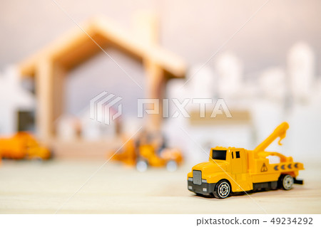 Yellow crane truck model on the table Yellow crane truck model on the table 49234292