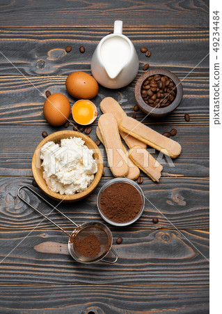 Ingredients for cooking tiramisu - Savoiardi biscuit cookies, mascarpone, cheese, sugar, cocoa Ingredients for cooking tiramisu - Savoiardi biscuit cookies, mascarpone, cheese, sugar, cocoa 49234484