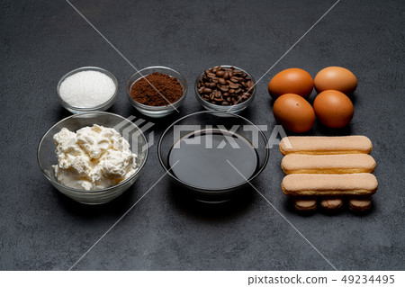 Ingredients for cooking tiramisu - Savoiardi biscuit cookies, mascarpone, cheese, sugar, cocoa 49234495