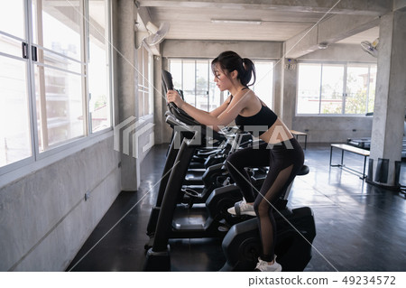 Exercise concept. Beautiful girl exercising with a 49234572