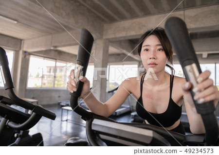 Exercise concept. Beautiful girl exercising with a 49234573