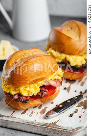 Breakfast sandwiches with scrambled egg Breakfast sandwiches with scrambled egg 49235252