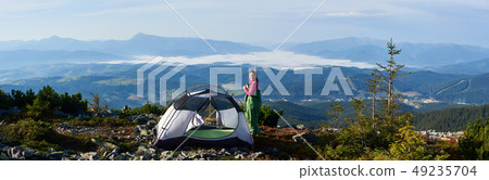 Camping on the top of mountain on bright summer morning 49235704