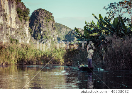 Vietnamese boat on the river. Tam Coc, Ninh Vietnamese boat on the river. Tam Coc, Ninh 49238082