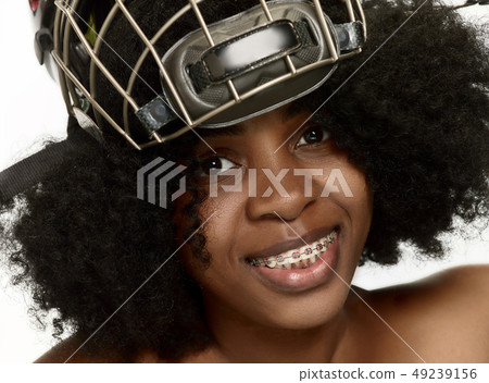 Female hockey player close up helmet and mask 49239156