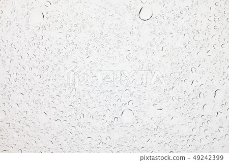 Rain droplets on glass background. 49242399