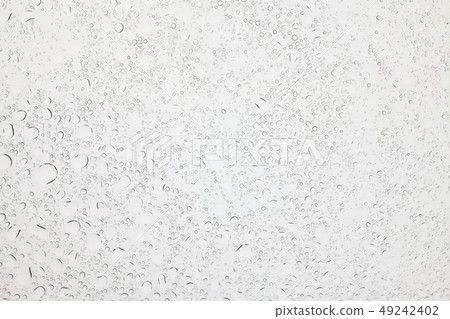 Rain droplets on glass background. 49242402