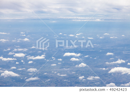 Clouds, sky and ground, looking from the plane. Clouds, sky and ground, looking from the plane. 49242423