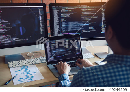Rear view of software developers is sitting 49244309