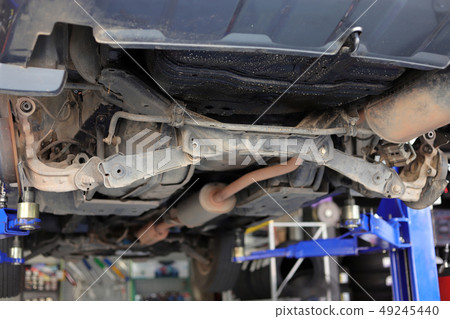 Under the car. 49245440