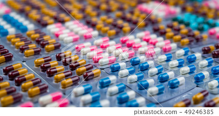 Selective focus on colorful antibiotic capsule Selective focus on colorful antibiotic capsule 49246385