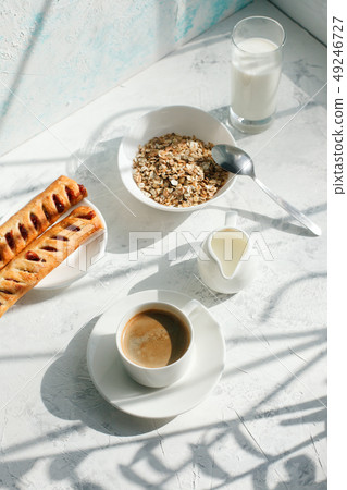 Breakfast from oatmeal with milk and cup of black 49246727