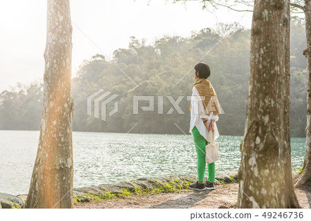 traveling Asian woman stand near the lake 49246736