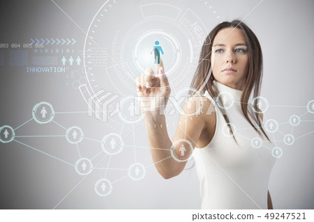 Woman touching the virtual future interface Woman touching the virtual future interface 49247521