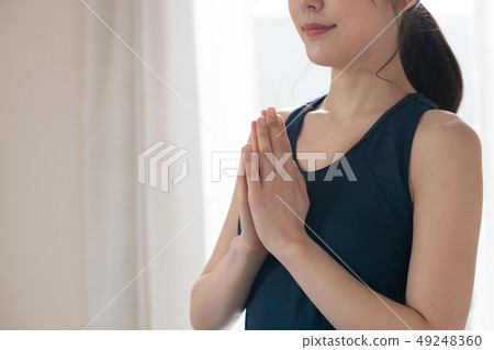 Young woman doing yoga Japanese meditation concentration Young woman doing yoga Japanese meditation concentration 49248360