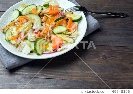 Vegetarian salad of raw fresh vegetables  49248396