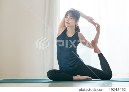 Young Woman Doing Yoga Japanese Dove Pose Dove Pose Hot Yoga 49248462