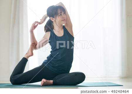 Young Woman Doing Yoga Japanese Dove Pose Dove Pose Hot Yoga 49248464