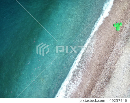 Aerial view turquois water of Ionian Sea in Albania shore and giant inflated cactus top view 49257546