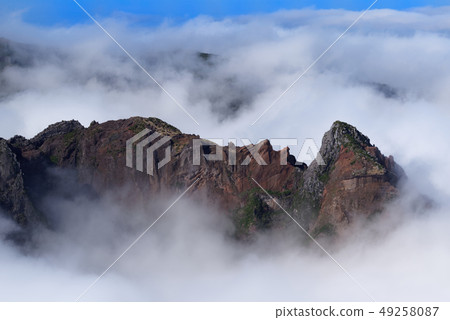 Rock formation in dense clouds on Pico do Arieiro Rock formation in dense clouds on Pico do Arieiro 49258087