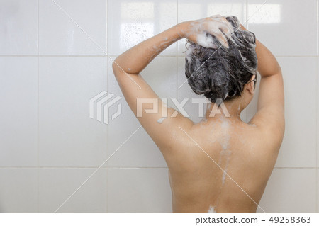 Young asian woman taking a shower and washing hair 49258363