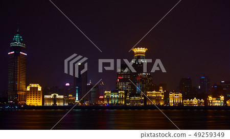 Shanghai, China - March 12, 2016: The Bund it is a waterfront area which runs along the western bank Shanghai, China - March 12, 2016: The Bund it is a waterfront area which runs along the western bank 49259349