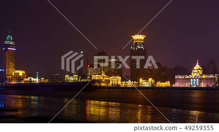 Shanghai, China - March 12, 2016: The Bund it is a waterfront area which runs along the western bank Shanghai, China - March 12, 2016: The Bund it is a waterfront area which runs along the western bank 49259355
