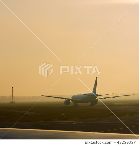 The takeoff plane in airport early morning The takeoff plane in airport early morning 49259357