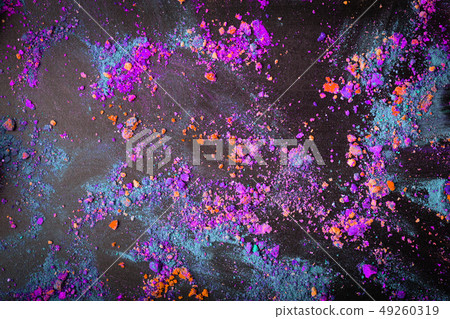 Colorful crumbled holi powder colors on black background. Flat lay Colorful crumbled holi powder colors on black background. Flat lay 49260319