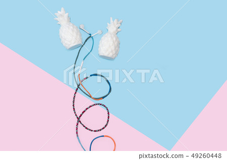 Colorful hippy earbud headphones on pastel blue background with copy space Colorful hippy earbud headphones on pastel blue background with copy space 49260448