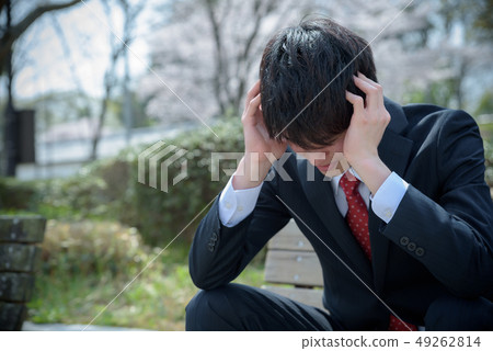 Businessman holding a head 49262814