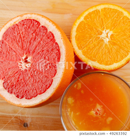 a glass of freshly-squeezed citrus juice a glass of freshly-squeezed citrus juice 49263392