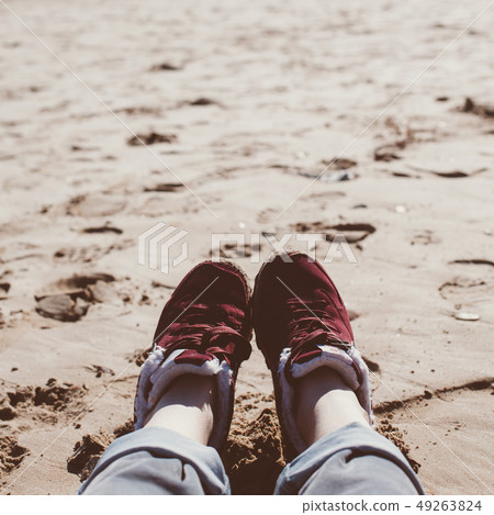 Girl relaxing on sand beach Girl relaxing on sand beach 49263824