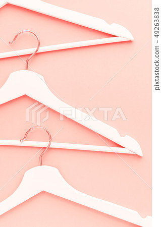 Wooden hangers toned living coral color 49263838