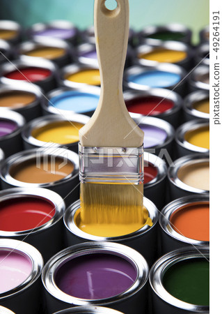 Tin cans with paint and brushes 49264191