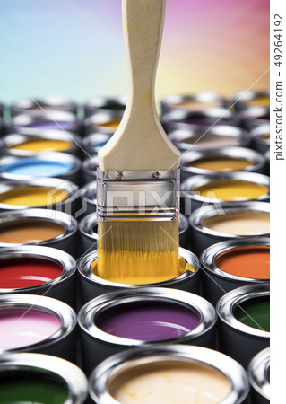 Tin cans with paint and brushes 49264192