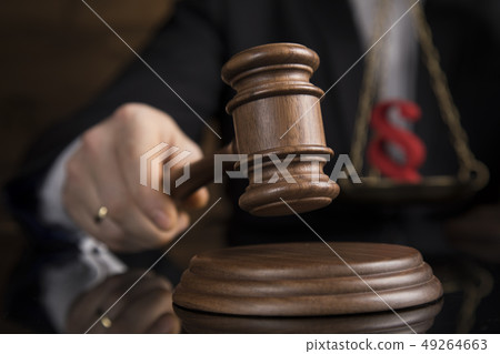 Judge, male judge in a courtroom striking the 49264663