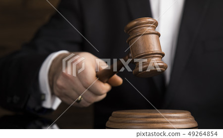Judge, male judge in a courtroom striking the 49264854