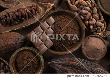 Cocoa beans and chocolate on natural paper Cocoa beans and chocolate on natural paper 49265765