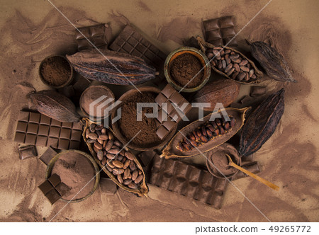 Cocoa beans and chocolate on natural paper Cocoa beans and chocolate on natural paper 49265772