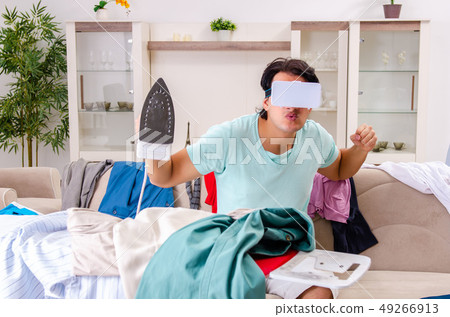 Young man husband ironing at home Young man husband ironing at home 49266913