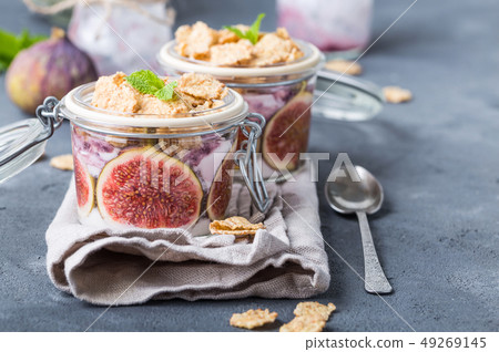 Yoghurt in jar with muesli Yoghurt in jar with muesli 49269145