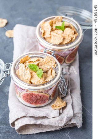 Yoghurt in jar with muesli Yoghurt in jar with muesli 49269149