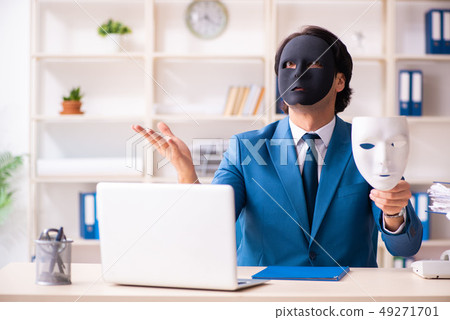 Male employee in the office in industrial espionage concept Male employee in the office in industrial espionage concept 49271701