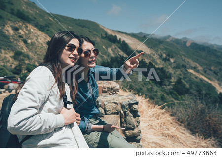 two active teenage hikers on top of mountain two active teenage hikers on top of mountain 49273663