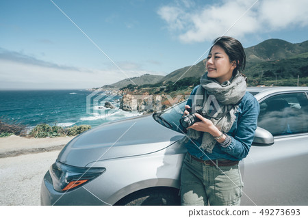 photographer seeing landscape during road trip 49273693